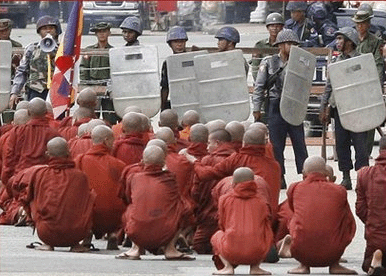 Buddhist monks in front of soldiers in Burma